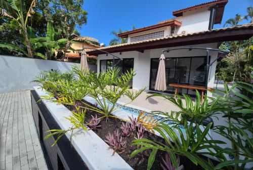 Costa do Sol Maison | 50m praia Cond pé na areia Alto padrao 4 suites Segur 24h Costa do sol Guaratuba Bertioga prox Riviera