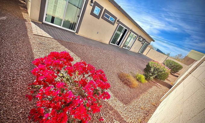 Estrella Village Maison | 9-Bedroom 7 bath Phoenix home with Modern Amenities & Patio Access & Events