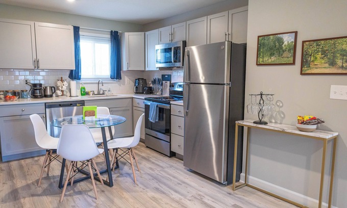 Shawnee Appartement | A charming bedroom with a king bed in quiet Shawnee neighborhood near highways.