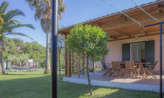 Marina di Campo Appartement | Albero del Pepe 2 with lush garden