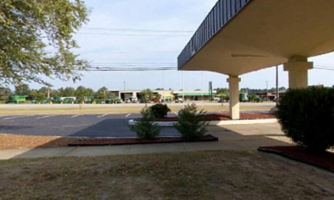 Wilson Appartement | Americas Best Value Inn Wilson - unité 18 un lit au premier étage