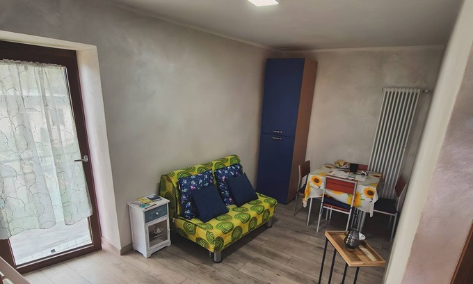 Cino Appartement | Appartement "Girasole" avec vue sur les montagnes, jardin privé et Wi-Fi