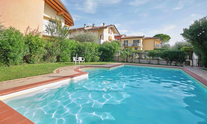 Montioni Appartement | Appartement 'Madonnina In Lazise' avec piscine partagée, Wi-Fi et climatisation