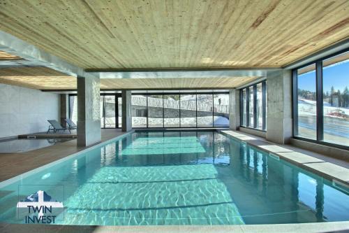 Arc-1600 Appartement | ARC 1600, LE RIDGE, Appartement 07 personnes Vue Montagne - ski aux pieds - Sauna, Hammam, Piscine, Salle de salle de sport-fitness