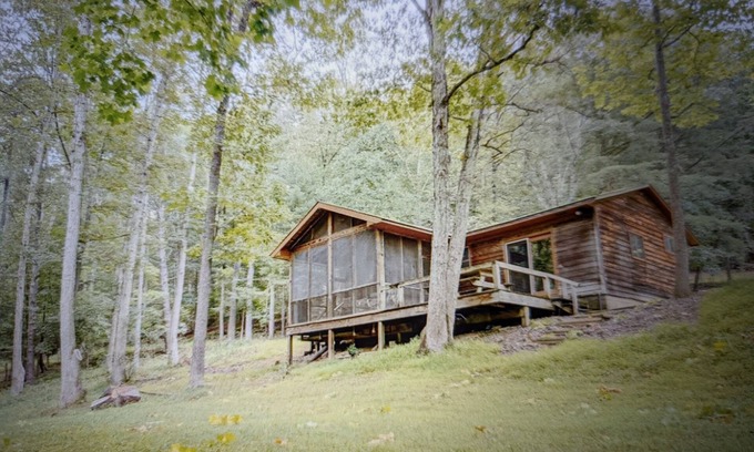 Harrisonville Cabine | Backyard creek, screened porch