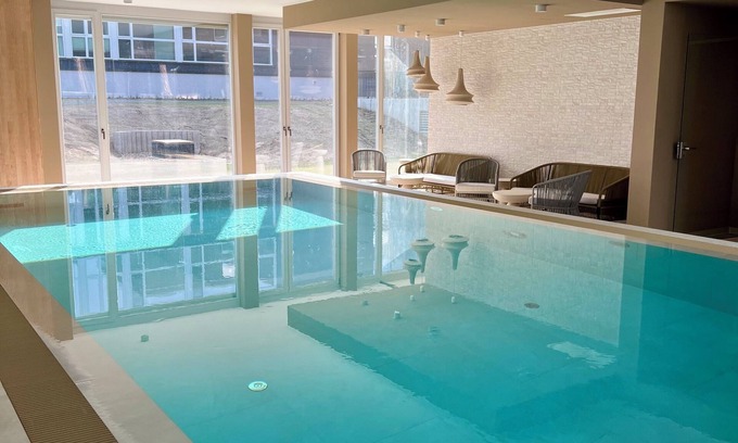 Bad Saarow Appartement | Bad Seerose, cozy vacation apartment with lake view, roof terrace, pool and sauna