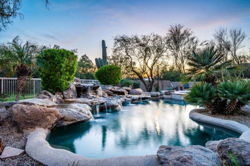 Desert View Village Maison | Barwick is a private oasis Practice on the putting green shoot pool and enjoy this city getaway.