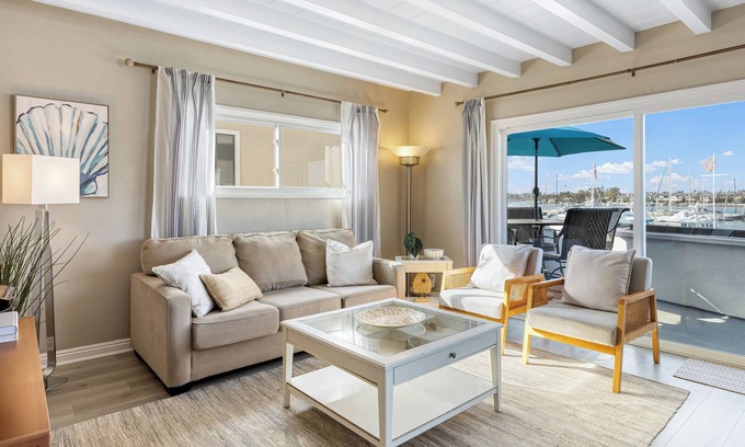Balboa Peninsula Maison | Bayfront Condo w/ Dock Access + Patio | Walk to Beach, Surf & Newport Dining