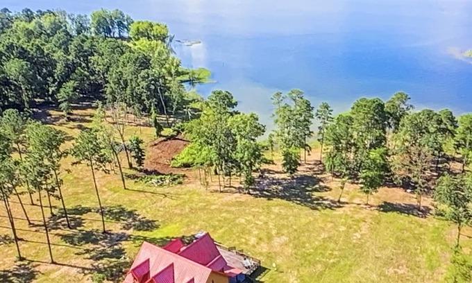 Broaddus Maison | Beautiful Lakefront Log Cabin that will take your breath away.