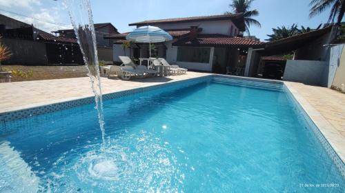 Jardim Neptunia Maison | Casa piscina pé na areia Bertioga