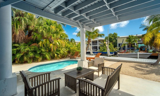 Breezeswept Beach Estates Maison | Cayman Retreat | Cozy coastal pool home with boating on Ramrod Key