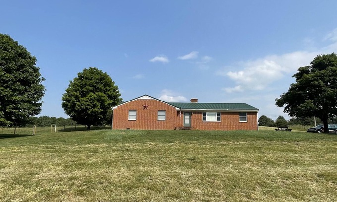 Mustoe Maison | Classic cozy brick ranch, with beautiful panoramic views!