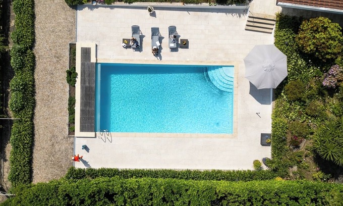 Paredes Maison | Classic Villa w/ Gym and Pool Access by HostWise
