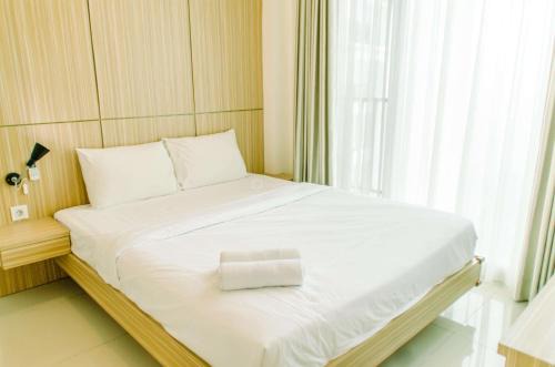 Serpong Appartement | Comfort and Minimalist 1BR at Tree Park City BSD Apartment By Travelio