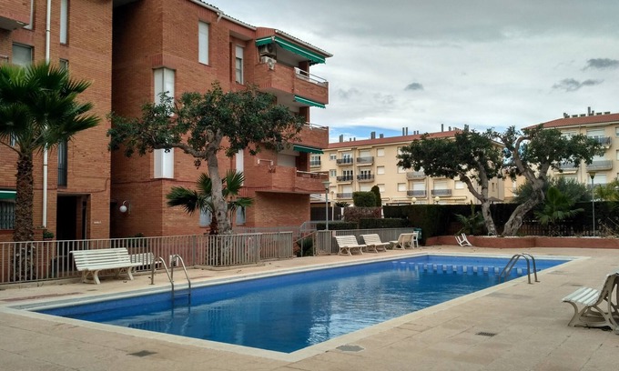 Comarruga Appartement | Appartement confortable, Wi-Fi A / C et piscine.