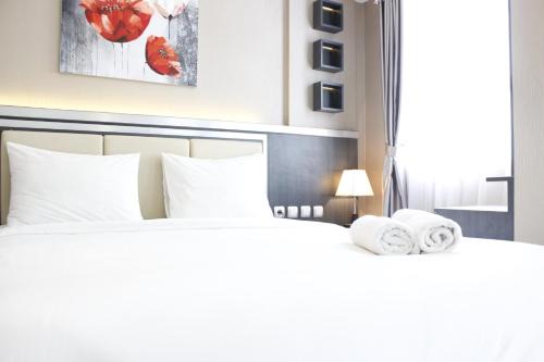 Cimahi Appartement | Convenient 1BR Gateway Pasteur Apartment By Travelio
