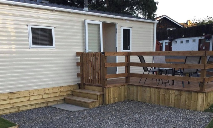 Boat of Garten Maison | Cosy chalet - Poppy Lodge in Boat of Garten, Dog Friendly, free wifi!