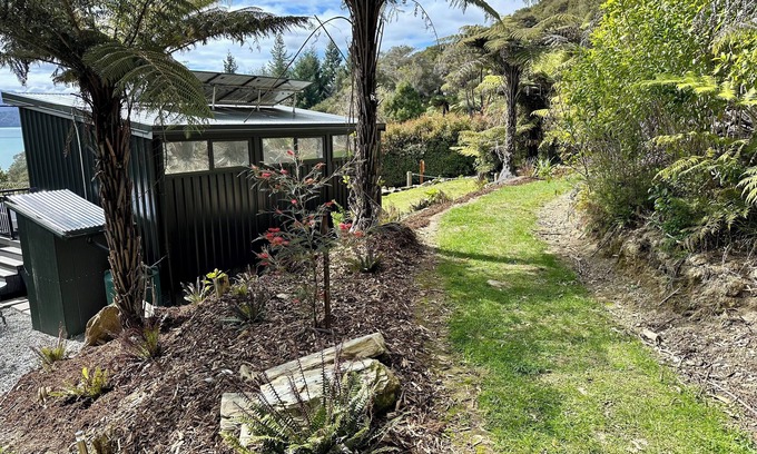 Moetapu Bay Cabine | A cosy two bedroom off-grid cabin, the perfect place to rest, relax & recharge.