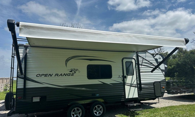 Dawson County Maison | Cozy camper with queen Murphy bed, bunks, and dinette conversion bed.