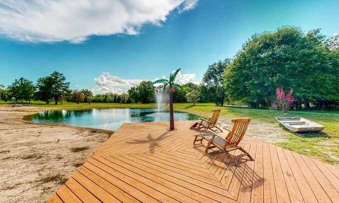 Waller Maison | Custom Home with Guesthouse, Pond, Swimming Deck, Beach & Tropical Bar