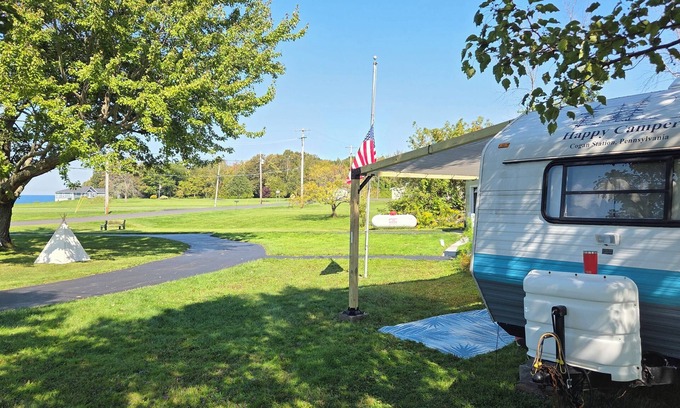 Oswego Maison | Dee's Tranquil Escape by the Lake a Cozy Camper in Oswego NY with AC & heat