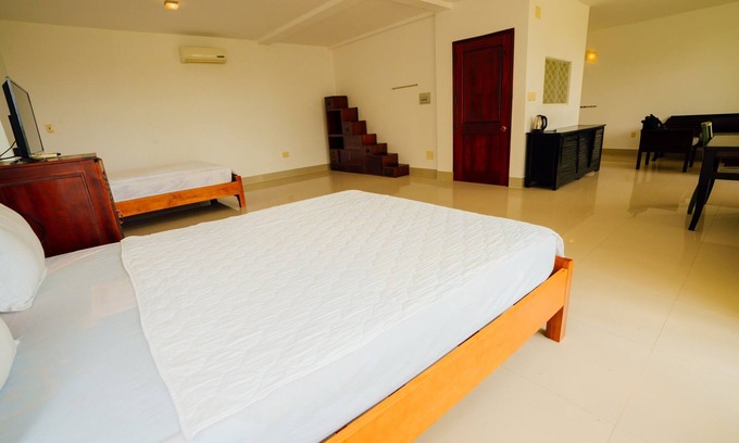Cua Lap Appartement | Chambre Familiale Delux - Vue sur Mer - Be Home 4 Sunset House