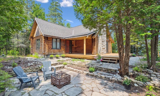 Lion's Head Cabine | Disconnect from it all at Stonewood, a cozy log chalet nestled in cedar forest on Georgian Bay. Enjoy a private shoreline, wraparound deck, wood stove, and access to kayaks, and trails. Peace, comfort, and adventure await in Cape Chin South.