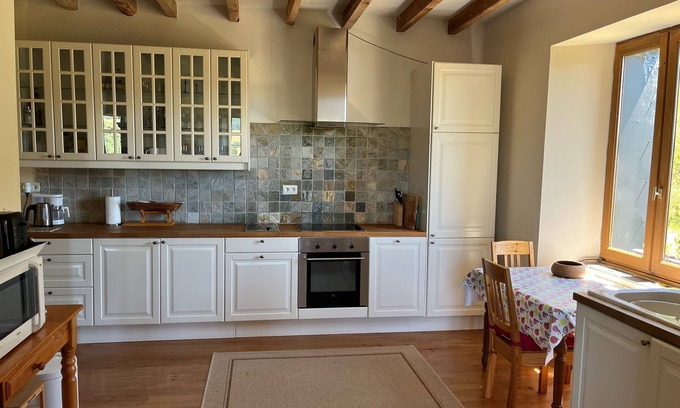 Compains Autre | Distinctive farmhouse on a hillside with panoramic views over volcanic landscape