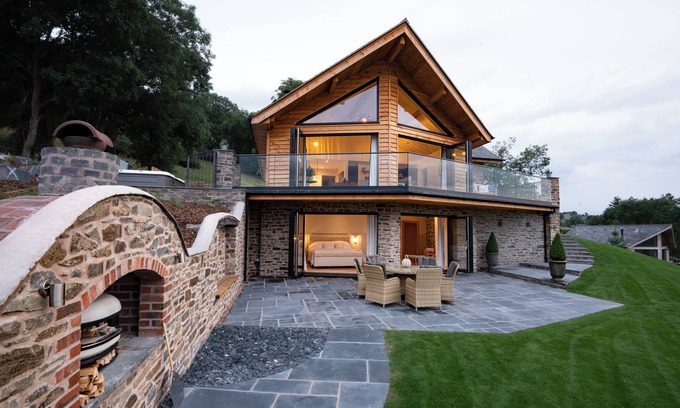 Montgomery Maison | Eithriadol Maldwyn is a collection of luxury countryside homes with a sauna and hot tubs. Pet friendly with electric car chargers, sleeping 16.