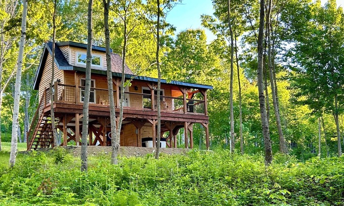 Canterbury Cabine | Elevated cabin nestled among the trees, and the Saint John River. Pet friendly.