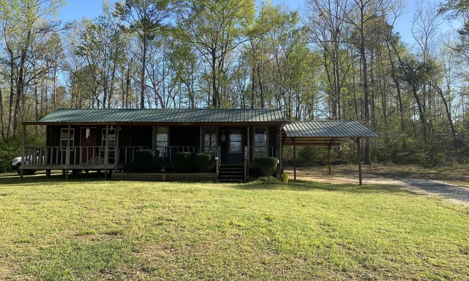 Gordo Cabine | Enjoy our stocked lake and 28 miles to The University of Alabama for football!