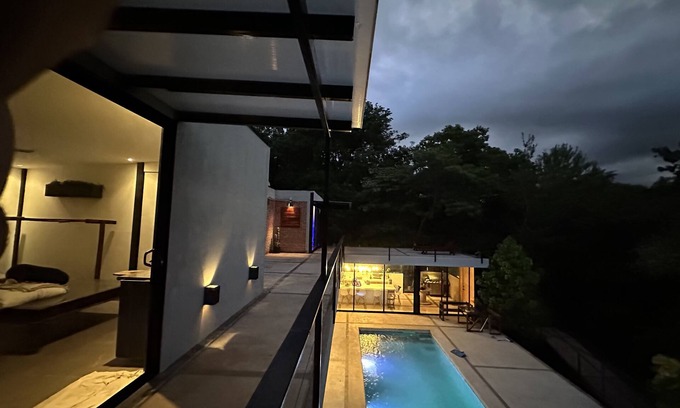 Santa Cruz Maison | Enjoy privacy and nature in this open concept home and relaxing pool.