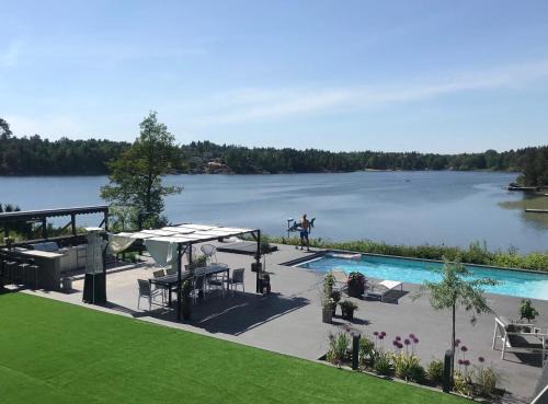 Tyreso Villa | Exclusive Lakefront Mansion with pools in Stockholm