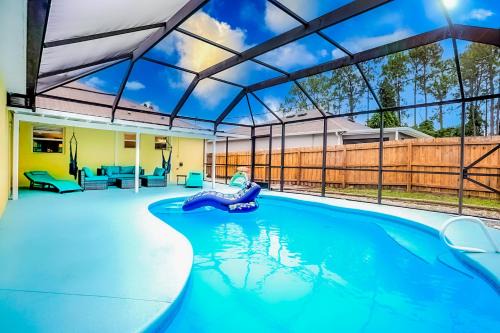 Palm Bay Maison | Family friendly paradise Pool Home!