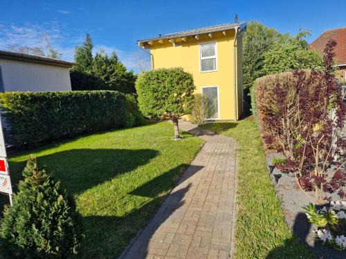 Sagard Maison | Ferienhaus an der Brunnenaue 4 Sterne, E-Ladestation am Haus, Wlan, Netflix, Garten