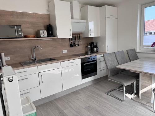 Norddeich Appartement | Ferienhaus Blütenzauber in Norddeich