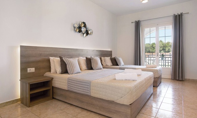 Alykes Appartement | Appartement de vacances "Tropical Studio 3" avec jardin partagé, climatisation et Wi-Fi.