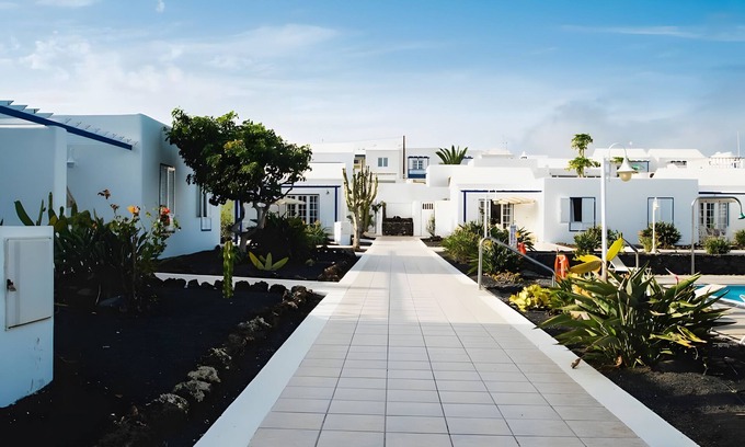 Arrieta Maison | Holiday Home 'Caleta Campos Bungalows' with Sea View, Shared Pool and Wi-Fi