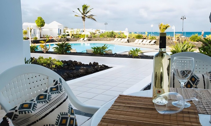 Arrieta Maison | Holiday Home 'Caleta Campos Bungalows' with Sea View, Shared Pool and Wi-Fi