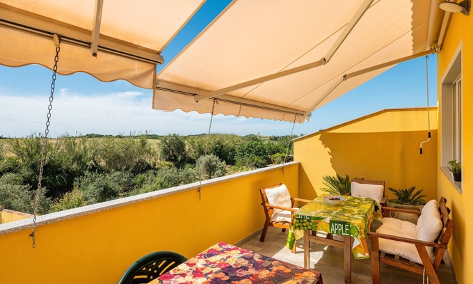 Giba Maison | Maison de vacances "Domus Luna" avec vue sur le lac, terrasse et climatisation.