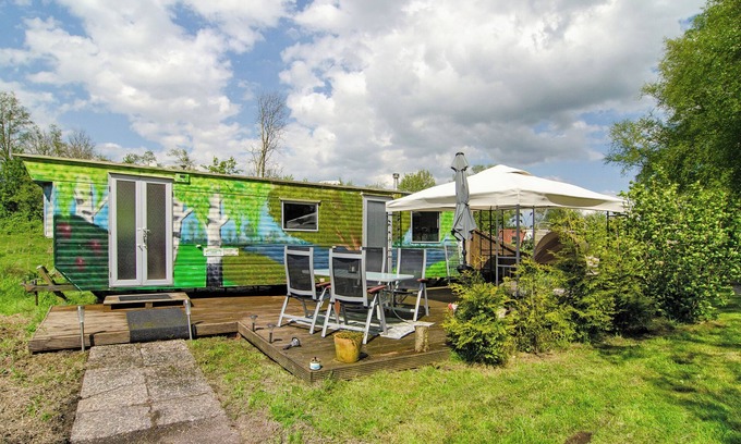 Detern Maison | Maison de vacances 'Süßes Häuschen Am See' avec terrasse privée et jardin privé
