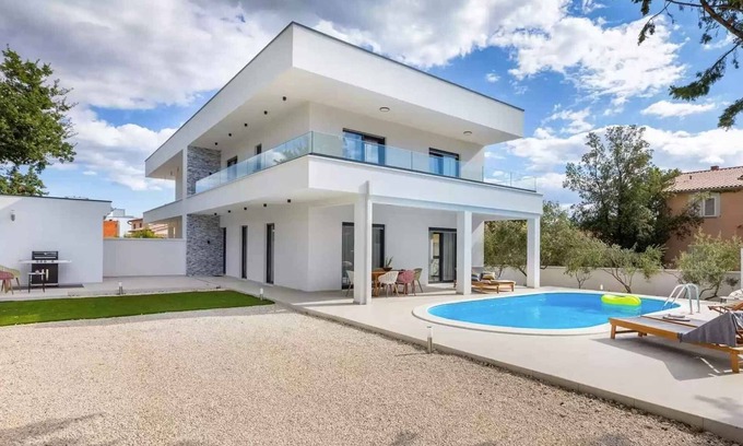 Barbariga Maison | Maison de vacances avec air conditionné et une piscine extérieure