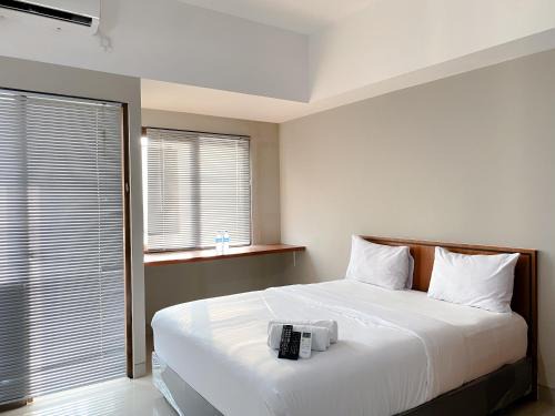 Jakarta Appartement | Homey and Minimalist Studio Gateway Park LRT City Jatibening Apartment By Travelio