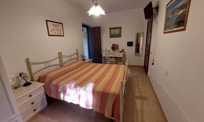 Iglesias Historic Centre Appartement | House The Ancient Olive Tree, nestled in a centuries-old olive grove with a large garden around it.