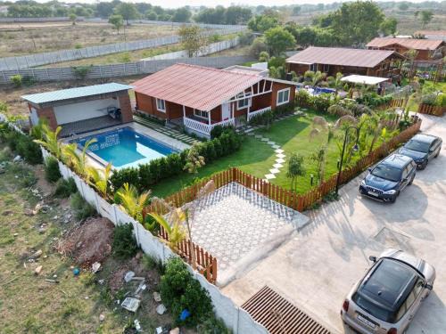 Chevella Chalet De Ski | Kuku farm stay 3 bedroom wooden cottage with private pool at Moinabad