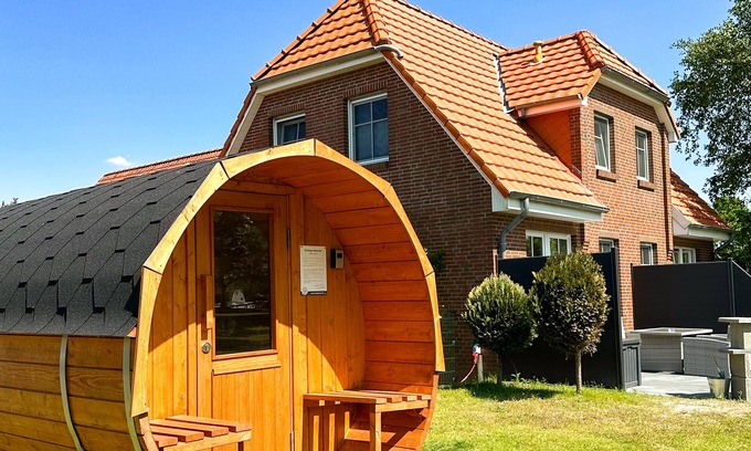 Tannenhausen Maison | Lüttje Huck - Ferienwohnung 3 mit Seeblick & Sauna