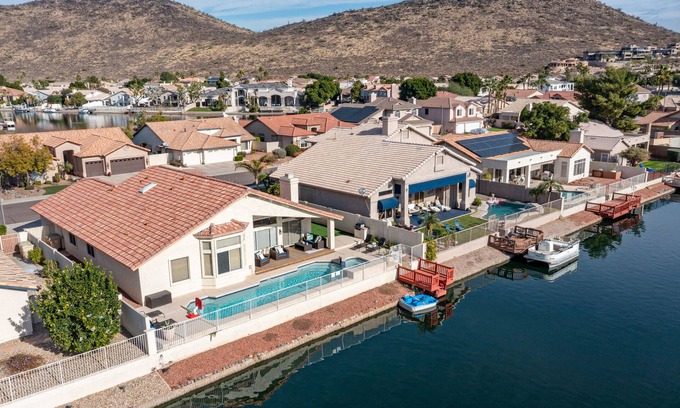 Arrowhead Lakes Maison | Lakefront Home complete with Mountain Views, Pool, Putting Green & Paddle Boat!