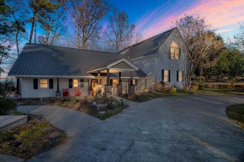 Gilbert Maison | Lakefront Luxury: Dock Fire Pit Game Room More