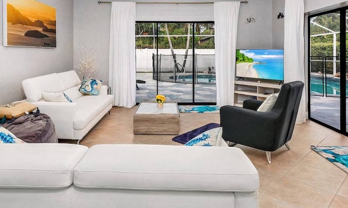 East Naples Maison | Larg heated pool, 3 bdrm, 2 bath, fast wi-fi, ps3, 4 smart TVs, large lanai with 2 covered areas.