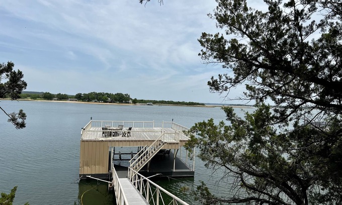 Graford Maison | Large, shady patio with deep-water two-story dock with sunset views. Sleeps 8
